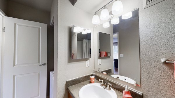 Bathroom featuring modern fixtures and sleek design at Glen at the Park Apartments