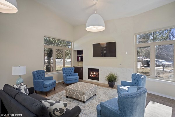 Clubhouse featuring modern decor and ample seating at Glen at the Park Apartments