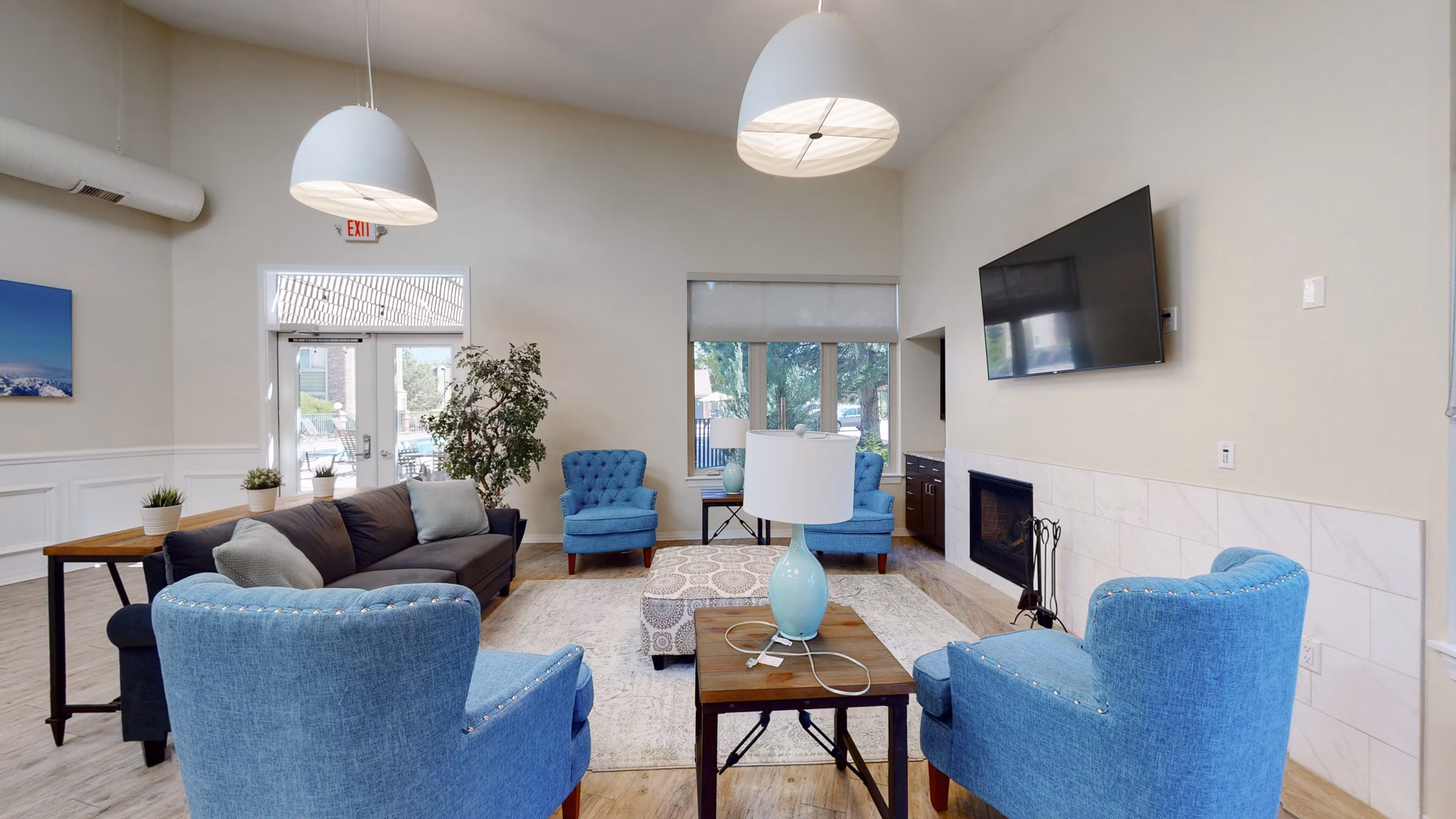 Modern clubhouse at Glen at the Park Apartments with luxury seating and decor, ideal for social gatherings and community events