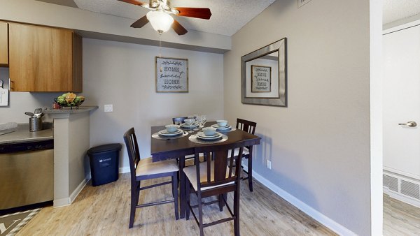 Dining area with elegant lighting and modern furnishings at Glen at the Park Apartments