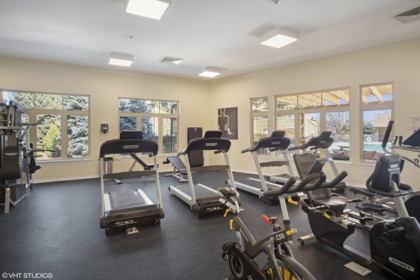 State-of-the-art fitness center at Glen at the Park Apartments with modern exercise equipment and spacious workout areas