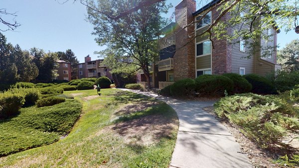 Courtyard at Glen at the Park Apartments featuring lush landscaping and seating areas for relaxation