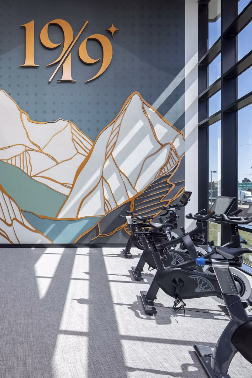 Fitness center with modern equipment at 1919 Mile High Apartments