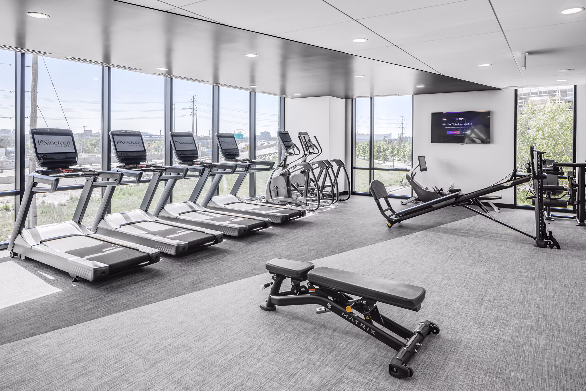 Fitness center with modern equipment at 1919 Mile High Apartments