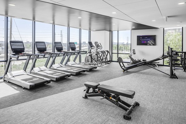 Fitness center with modern equipment at 1919 Mile High Apartments