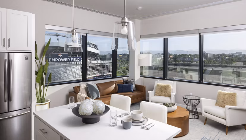 Open concept kitchen with stainless steel appliances at 1919 Mile High Apartments