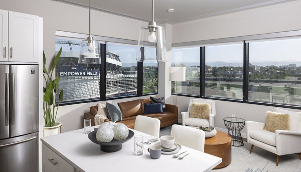 Open concept kitchen with stainless steel appliances at 1919 Mile High Apartments