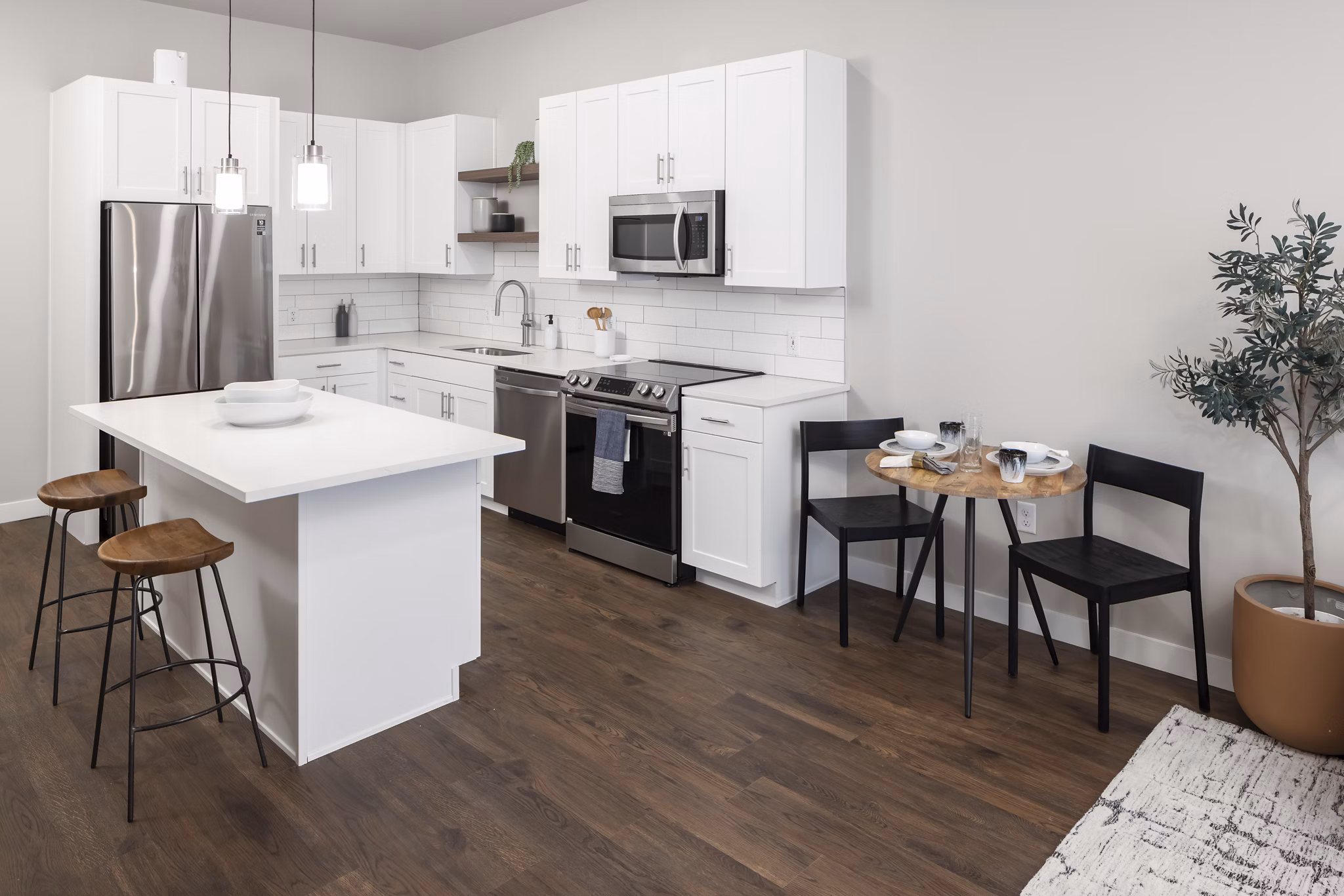 Modern kitchen with stainless steel appliances at 1919 Mile High Apartments