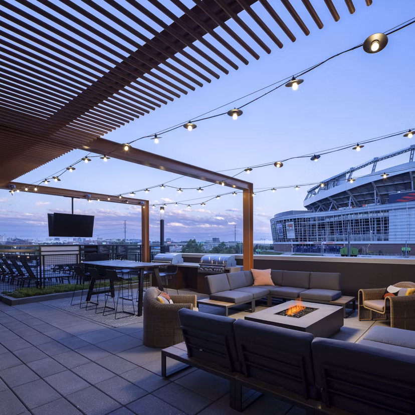 Scenic mountain views from a rooftop deck at 1919 Mile High Apartments