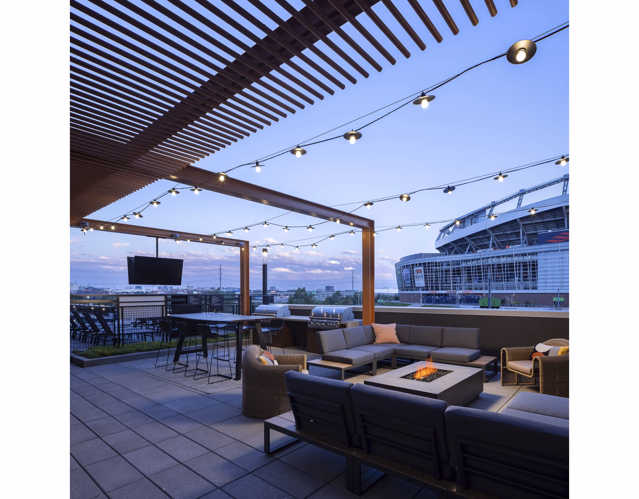 Scenic mountain views from a rooftop deck at 1919 Mile High Apartments