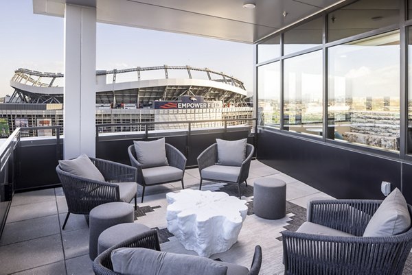 Outdoor patio with modern seating at 1919 Mile High Apartments offering scenic views