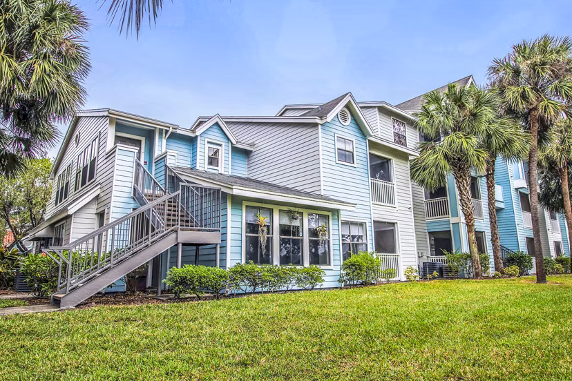 The Retreat at Vista Lake: Elegant building showcasing luxury apartments near lakeside