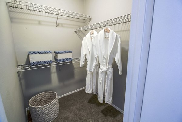 Walk-in bedroom closet with ample storage at The Retreat at Vista Lake Apartments