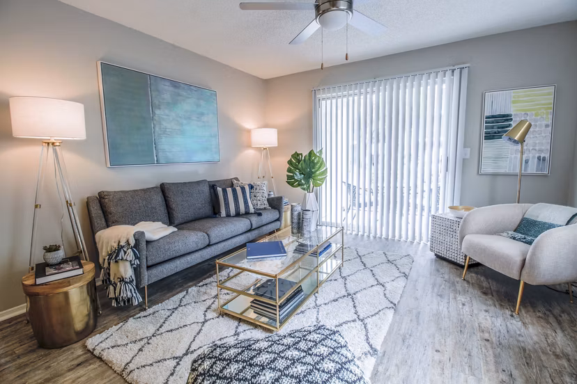 Spacious living room with elegant design and natural lighting in The Retreat at Vista Lake Apartments