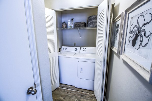 Modern laundry room with energy-efficient appliances at The Retreat at Vista Lake Apartments