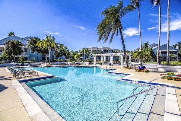 Infinity pool with resort-style seating at The Retreat at Vista Lake Apartments