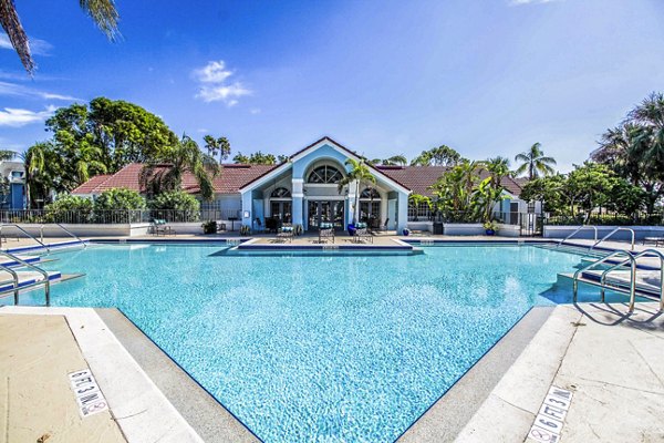 Inviting poolside oasis at The Retreat at Vista Lake Apartments, surrounded by lush landscaping, perfect for relaxation and leisure activities