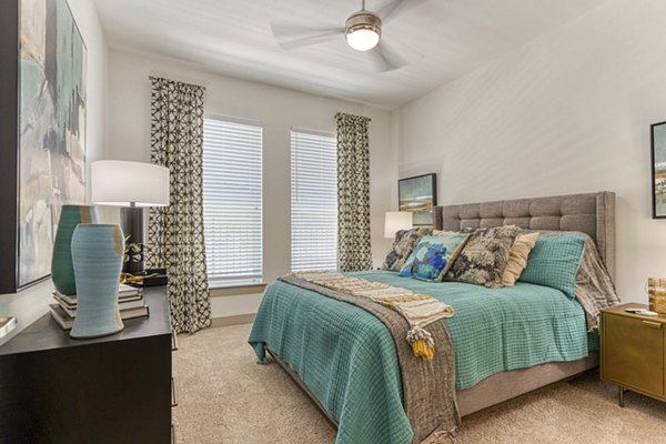 bedroom at Alexan Riverside Apartments