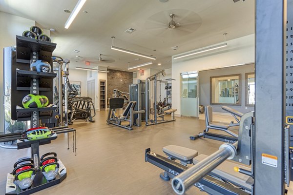 fitness center at Alexan Riverside Apartments