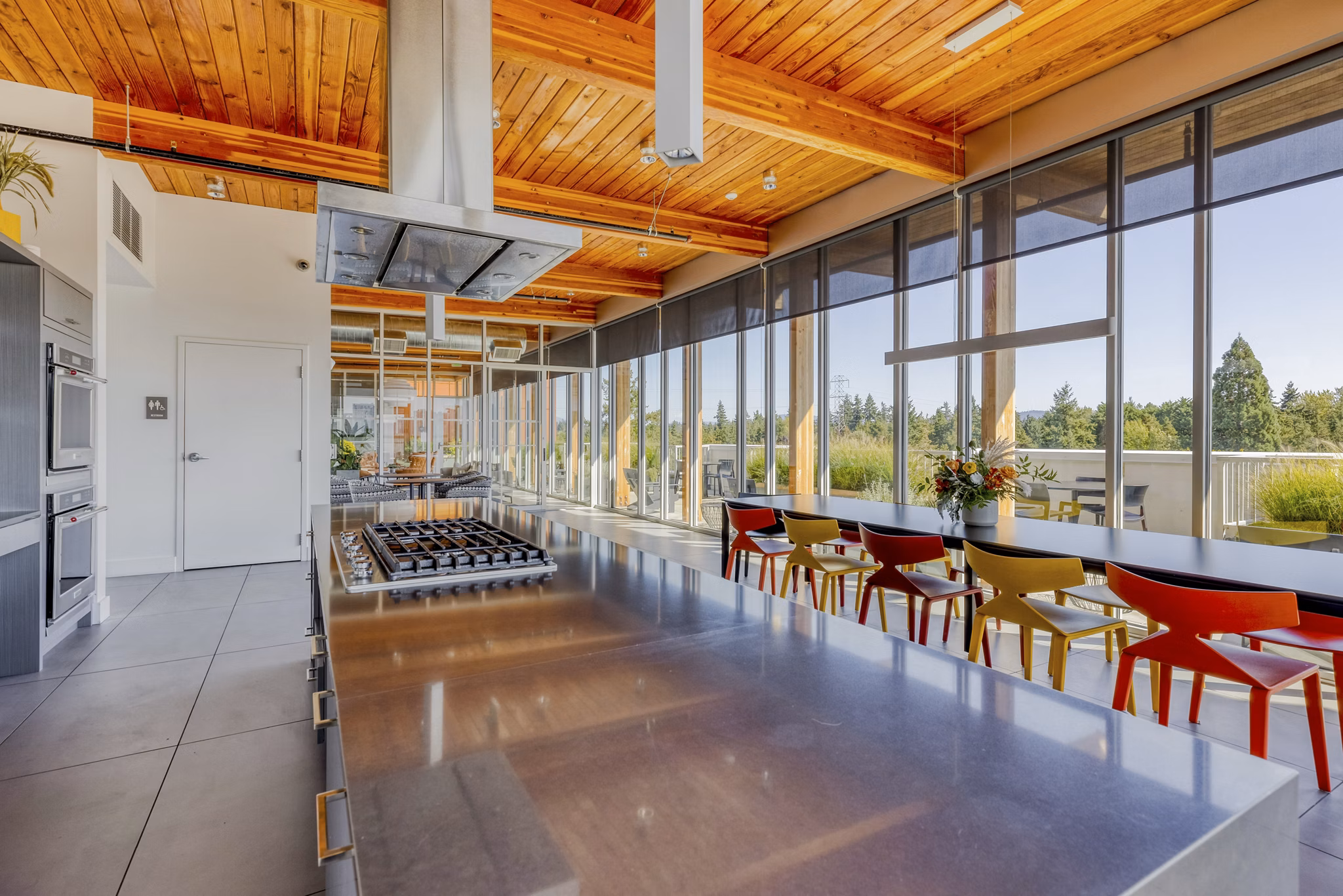 Modern clubhouse with stylish seating and entertainment options at Arras Apartments, luxury living in a vibrant community