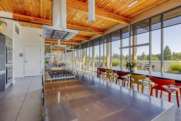 Modern clubhouse with stylish seating and entertainment options at Arras Apartments, luxury living in a vibrant community