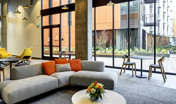 Clubhouse featuring modern design and entertainment spaces at Arras Apartments