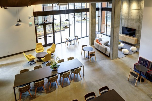 Clubhouse with contemporary design and comfortable seating at Arras Apartments in the Greystar luxury community