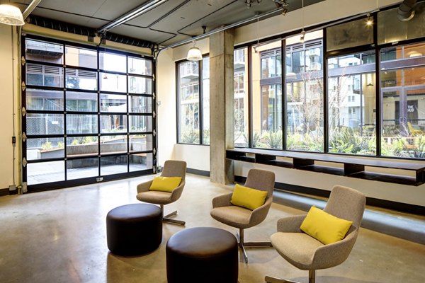 Clubhouse featuring modern lounge seating and entertainment options at Arras Apartments