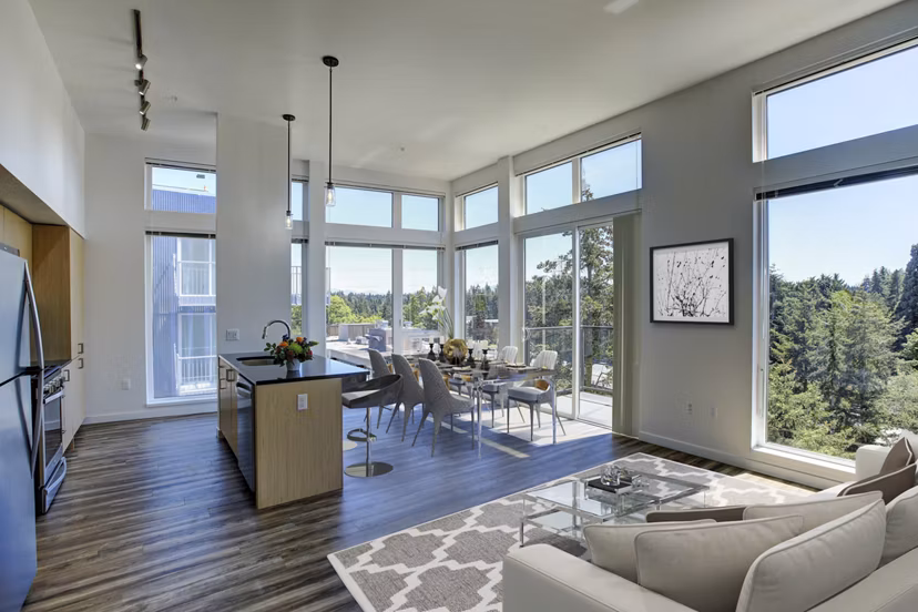 Spacious living room with modern dÃ©cor and ample natural light at Arras Apartments