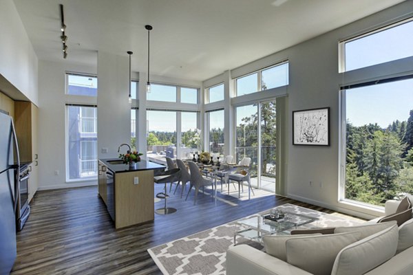 Spacious living room with modern dÃ©cor and ample natural light at Arras Apartments