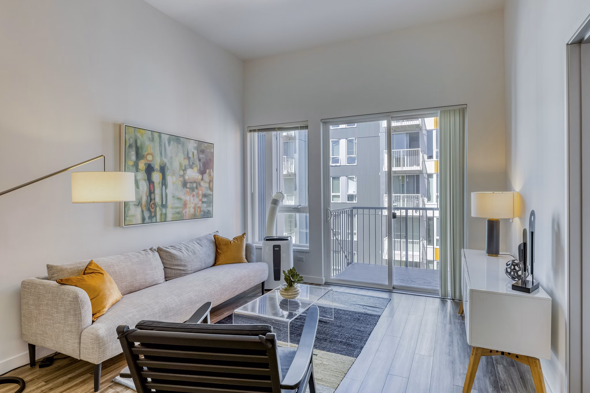 Spacious living room with modern furnishings at Arras Apartments