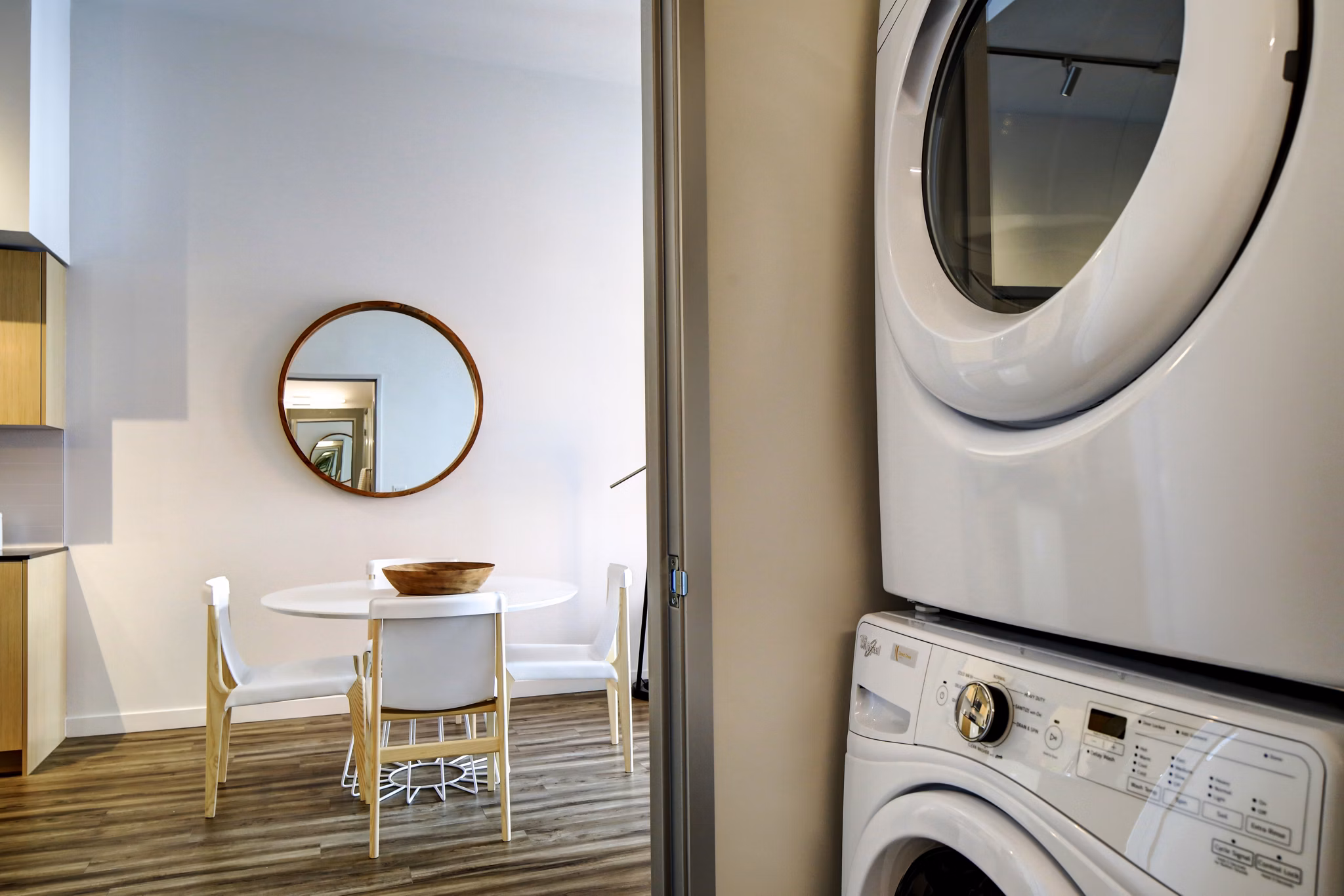 Laundry room featuring high-efficiency washers and dryers at Arras Apartments