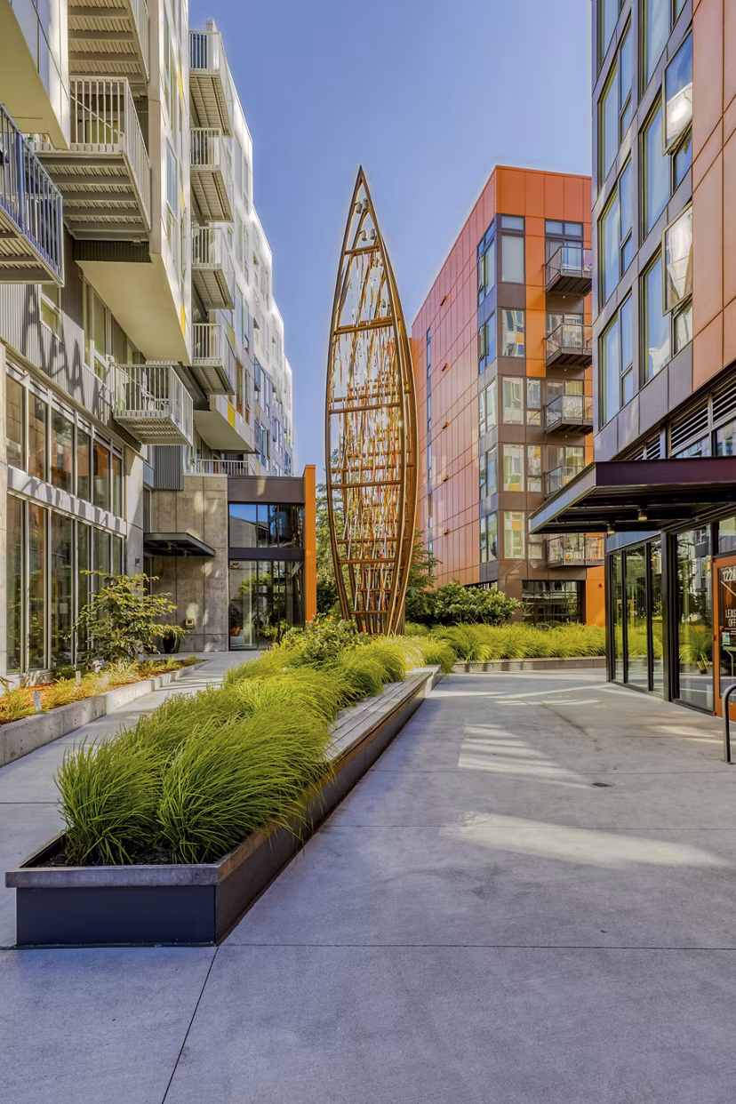 Arras Apartments: Lush courtyard with seating and greenery for relaxation