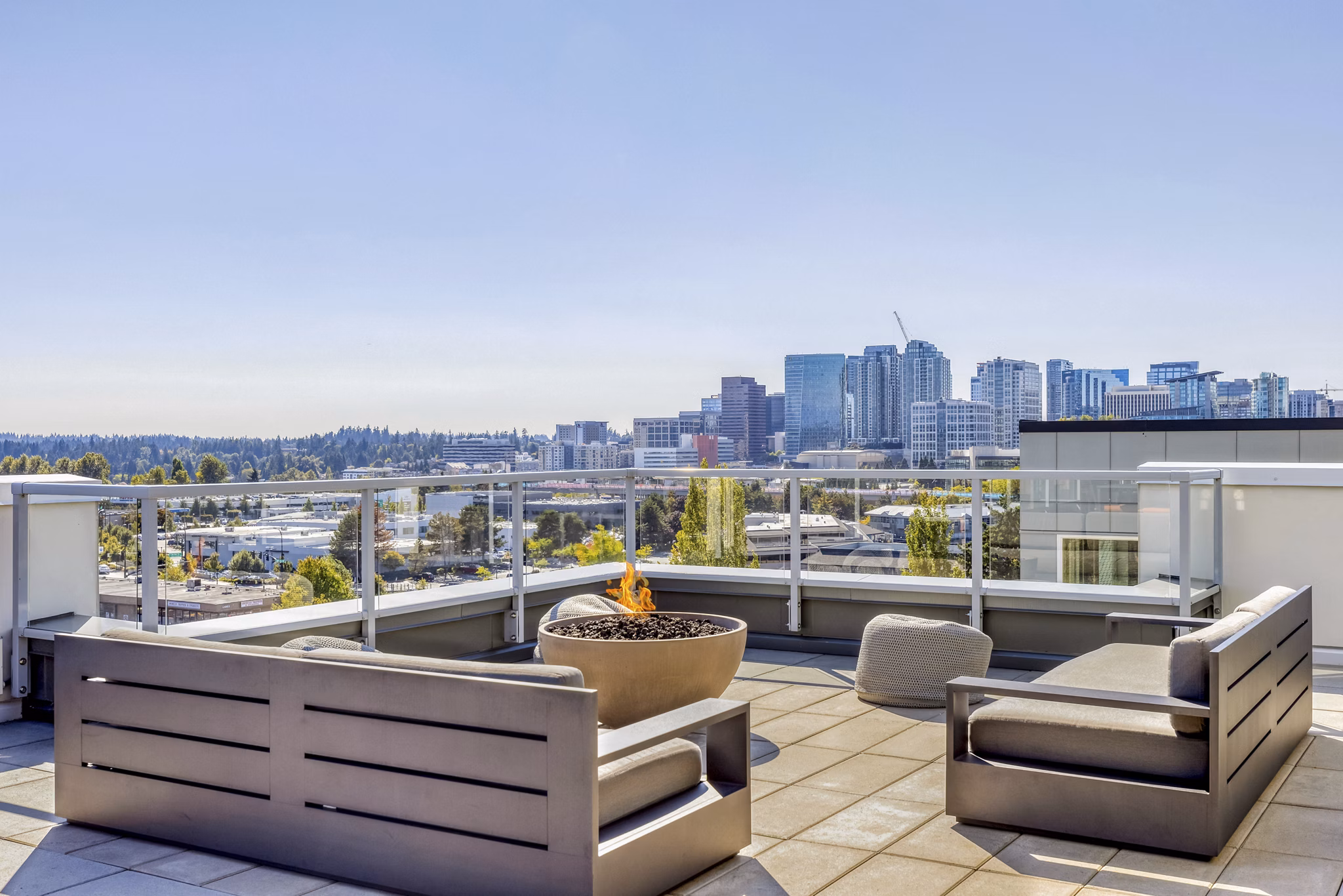 Scenic rooftop deck at Arras Apartments offering luxury outdoor seating and city views