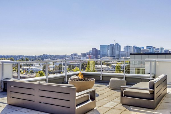 Scenic rooftop deck at Arras Apartments offering luxury outdoor seating and city views