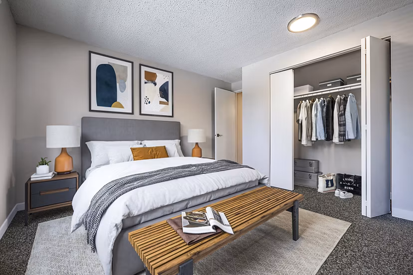 Cozy bedroom with modern furnishings in 1202 Pearl Apartments