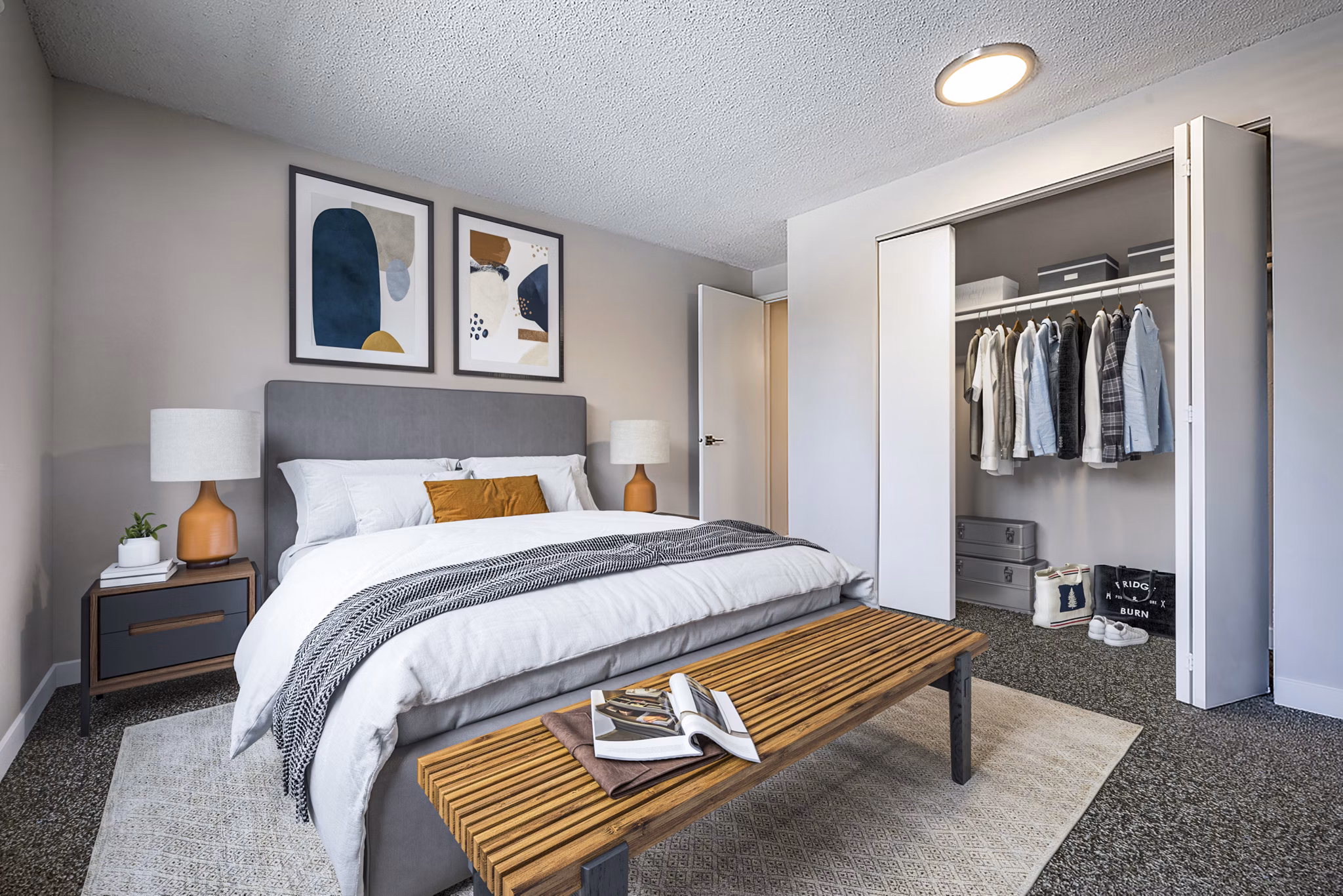 Cozy bedroom with modern furnishings in 1202 Pearl Apartments