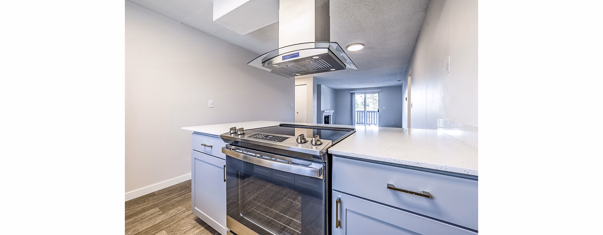 Modern kitchen with stainless steel appliances in 1202 Pearl Apartments