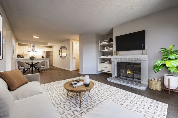 Modern living room with hardwood floors and contemporary decor at 1202 Pearl Apartments