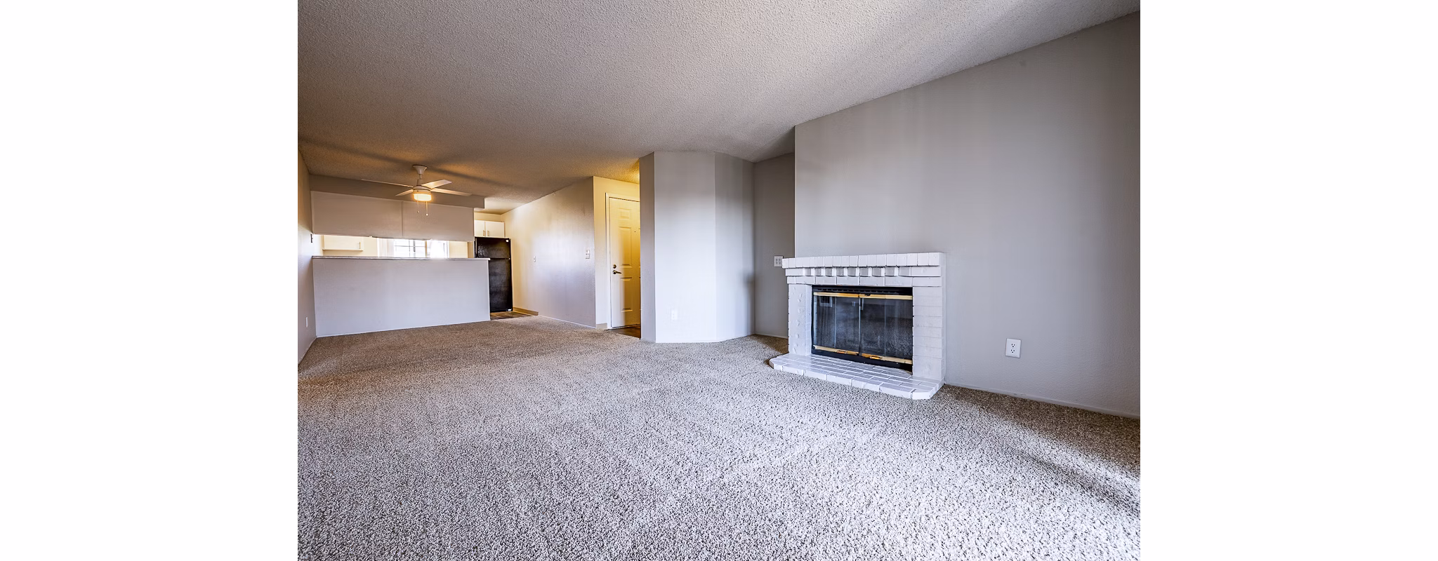 Modern living room with natural light and sleek furniture at 1202 Pearl Apartments
