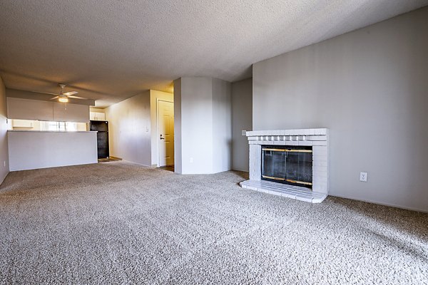 Modern living room with natural light and sleek furniture at 1202 Pearl Apartments