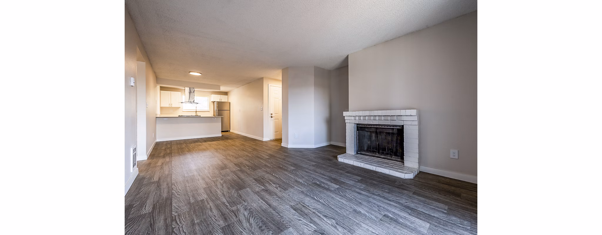 Spacious living room with modern decor in 1202 Pearl Apartments