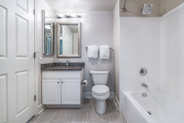 Bathroom featuring modern fixtures and elegant design at The Barton at Woodley Apartments