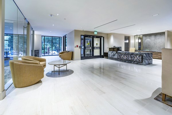 Clubhouse with elegant seating and modern decor at The Barton at Woodley Apartments