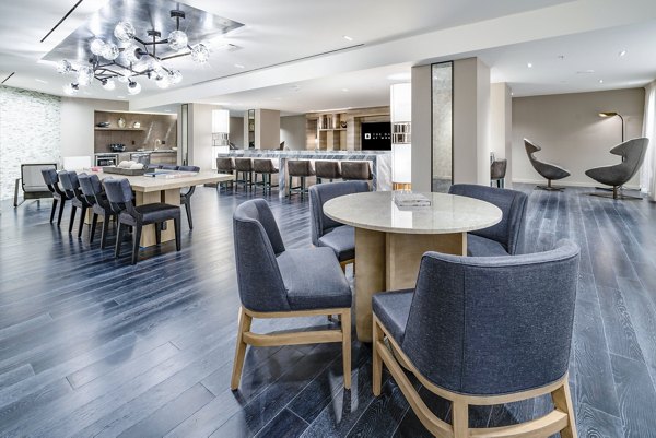 Clubhouse featuring modern design and comfortable seating at The Barton at Woodley Apartments