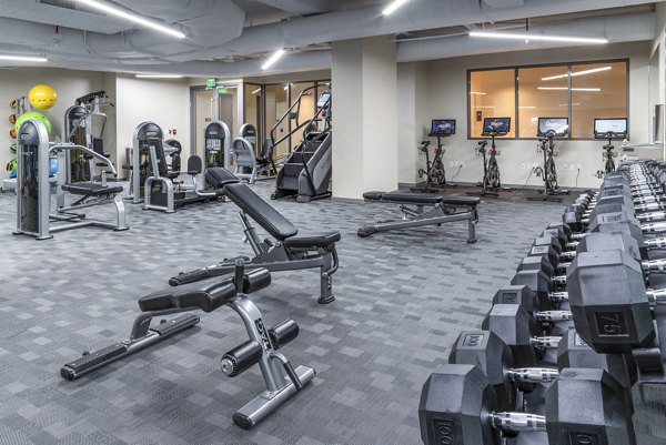 fitness center at The Barton at Woodley Apartments