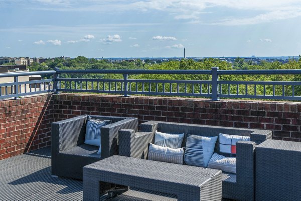 The Barton at Woodley: Cozy patio with seating area at luxury apartments near city center