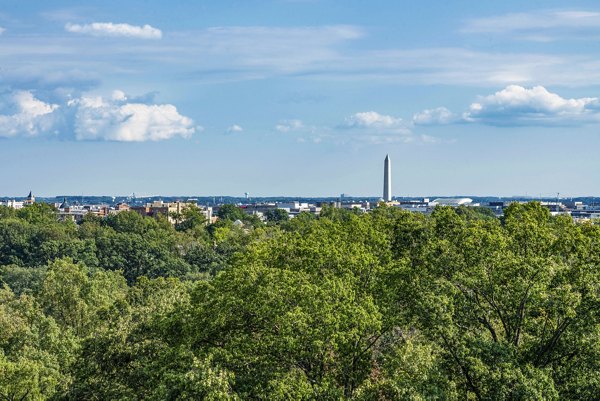 Breathtaking city skyline view from luxury apartment balcony at The Barton at Woodley Apartments