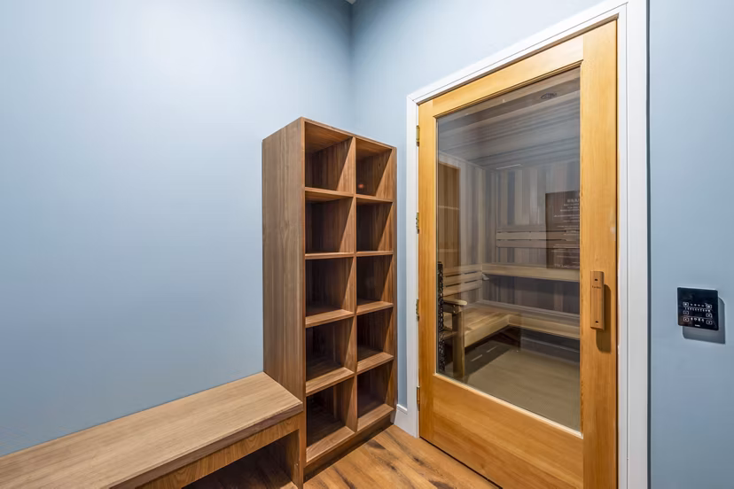 Clubhouse sauna with modern wooden interior at The Waterview Apartments offering relaxation and wellness amenities