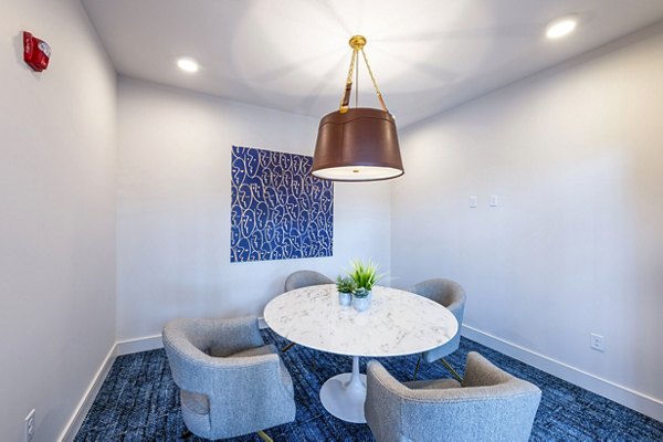 Clubhouse meeting facility with modern seating and AV equipment at The Waterview Apartments, luxury community with river views